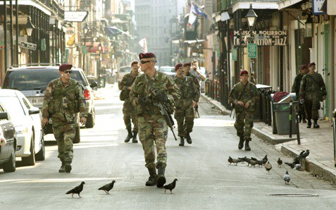 On Bourbon Street in New OrleansÕ famous French Quarter, paratroopers from Bravo Company, 2nd Battalion, 505th Parachute Infantry Regiment, 82nd Airborne Division, patrol nearly deserted streets. (Photo by Daren Reehl)