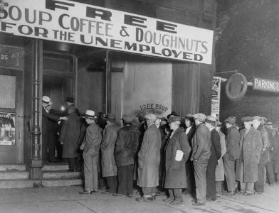16 Nov 1930, Chicago, Illinois, USA --- Notorious gangster Al Capone attempts to help unemployed men with his soup kitchen "Big Al's Kitchen for the Needy." The kitchen provides three meals a day consisting of soup with meat, bread, coffee, and doughnuts, feeding about 3500 people daily at a cost of $300 per day. --- Image by © Bettmann/CORBIS